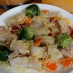 Хек с овощами на пару
