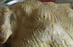Нафаршировать курицу луком,чесноком и лимоном.Заколоть зубочисткой.Хорошо смазать кожицу курицы горчицей.Смазать маслом форму,уложить туда курицу и отправить в разогретую духовку на 230 градусов на 15-20 минут чтоб спинка курицы зарумянилась.Затем снизить температуру до 150 градусов,накрыть форму крышкой или фольгой и томить курицу 2.5 часа.Достаём курицу,начинку вынимаем и разрезаем курицу на части.